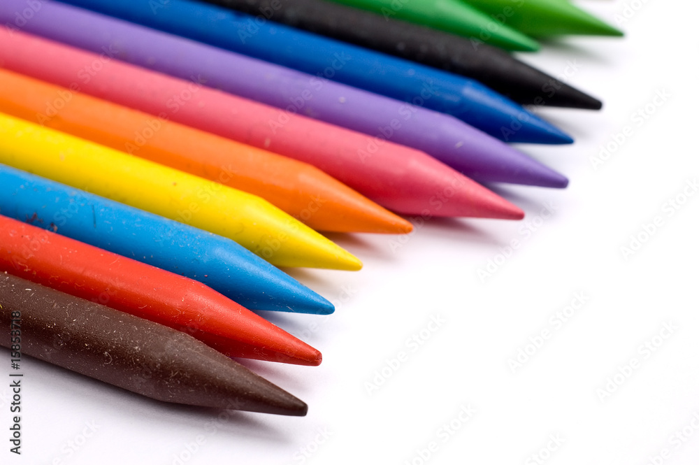 Fototapeta premium Many colorful wax crayons in a row (shallow depth-of-field)