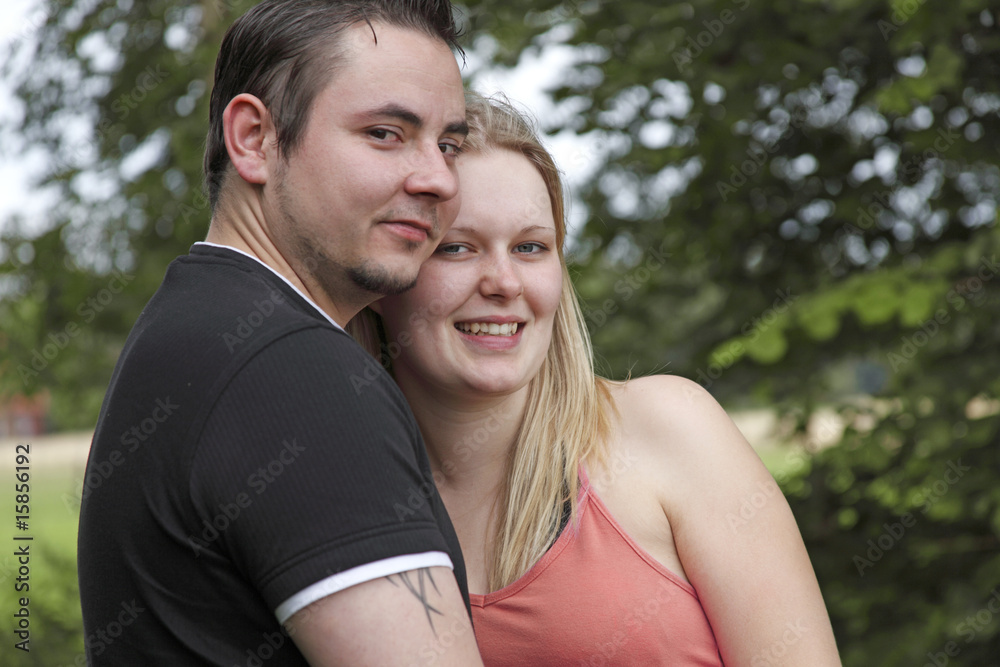 Young couple hugging one another