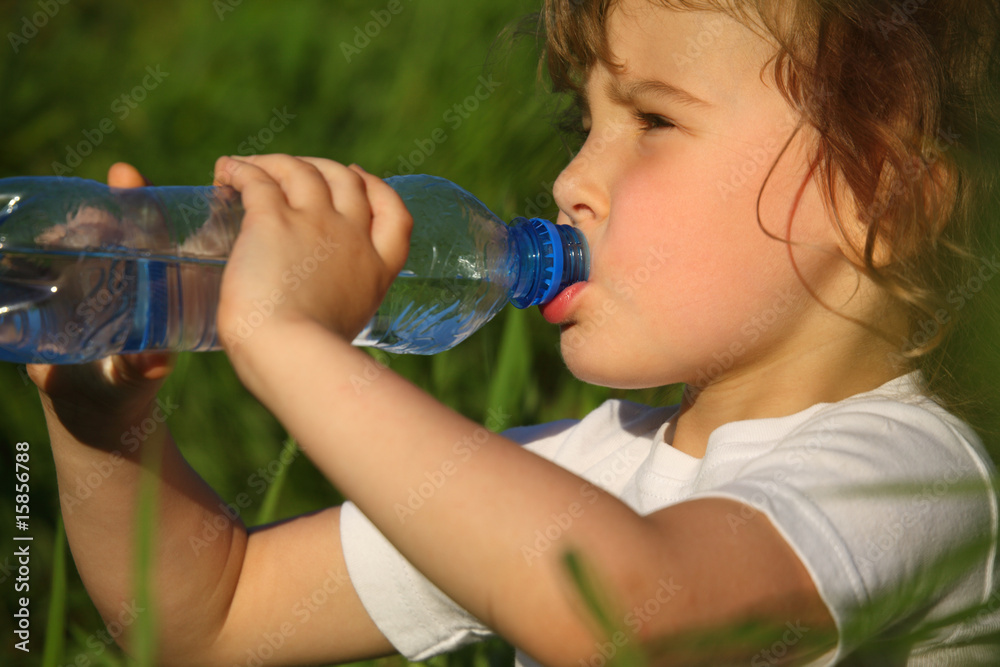 closeup portrait of drinking girl in grass closeup portrait of drinking girl in grass