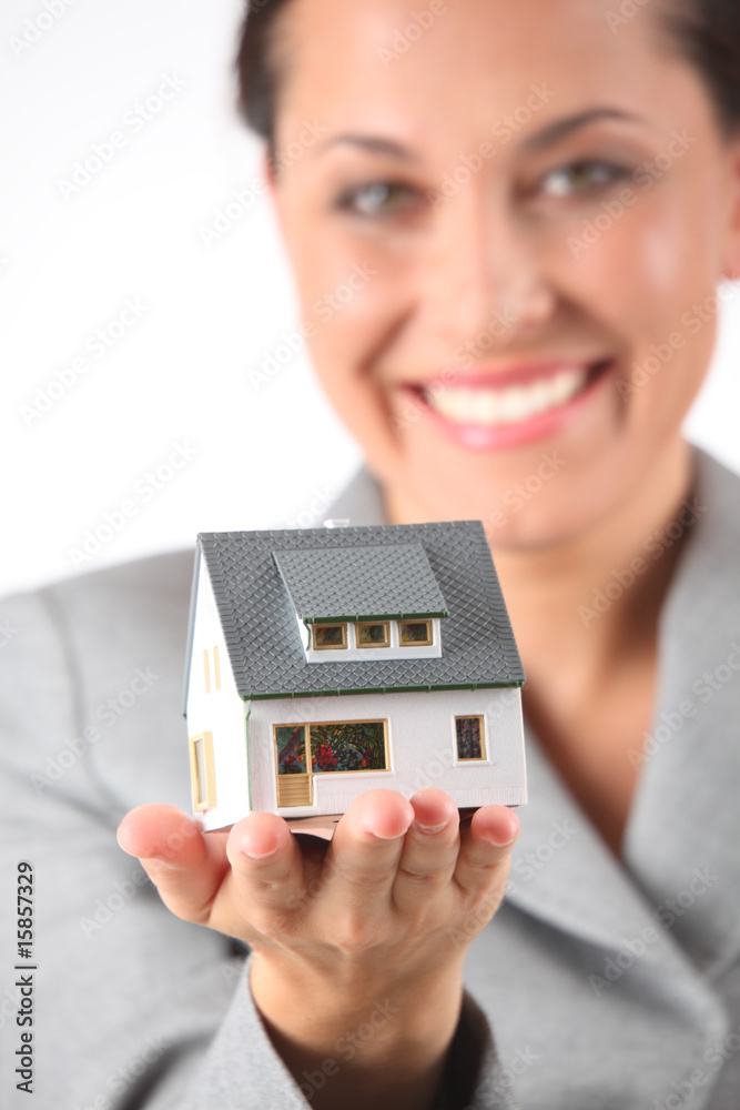 business woman holds model of house business woman holds model of house
