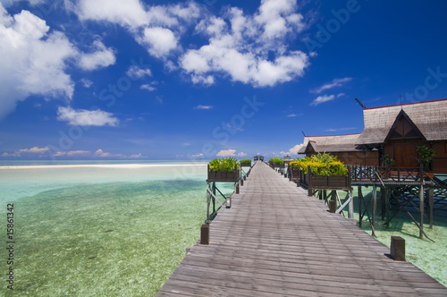 Walkway to tropical island resort