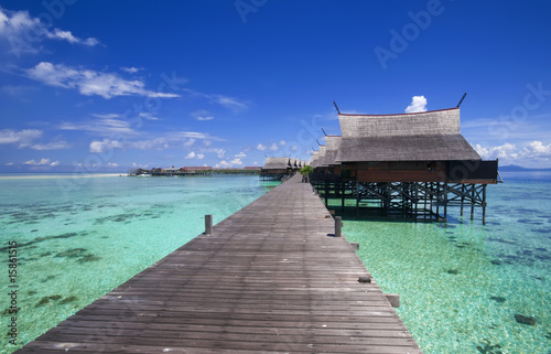 Tropical island resort on crystal clear water.