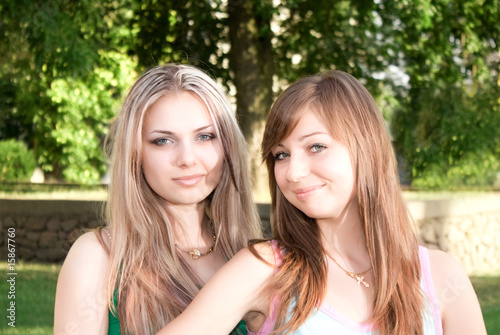 Two friends on grass background