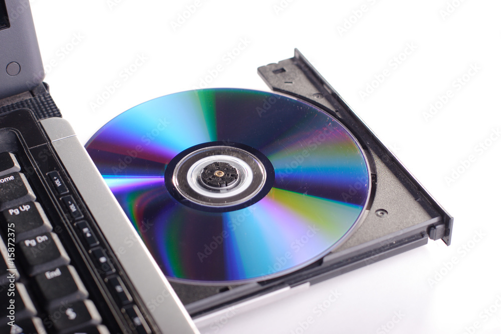 DVD ROM on a laptop opened to show disc. DVD ROM on a laptop opened to show disc.