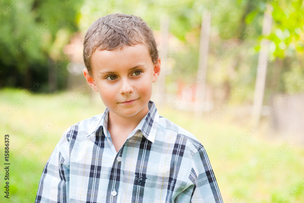 Cute kid outdoors in a grass field Cute kid outdoors in a grass field