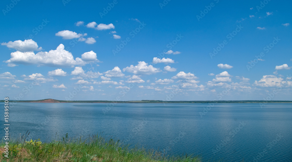 quiet water of lake and cloudy sky