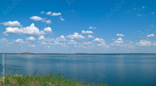Fototapeta Naklejka Na Ścianę i Meble -  quiet water of lake and cloudy sky