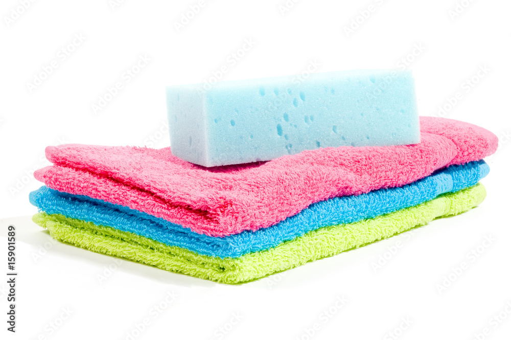 Multicolour towels stacked and body sponge Multicolour towels stacked and body sponge