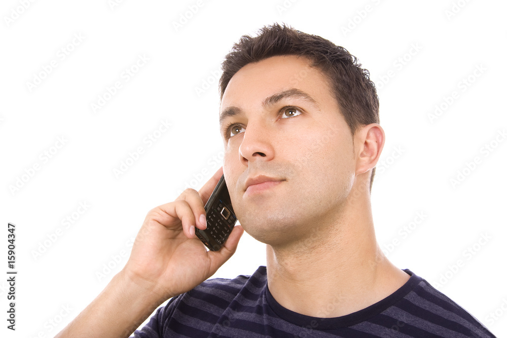 Young casual man using cellphone isolated on whithe