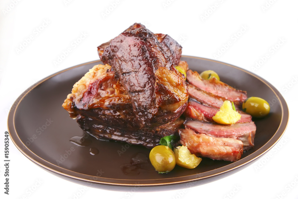 ribs on old style ceramic dish over white