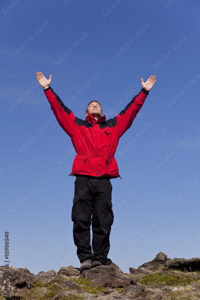 Man Celebrating Success On Top Of A Mountain Man Celebrating Success On Top Of A Mountain