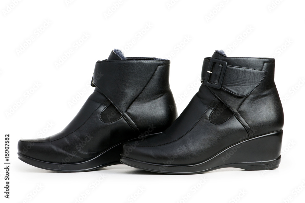 Black boots isolated on the white background Black boots isolated on the white background