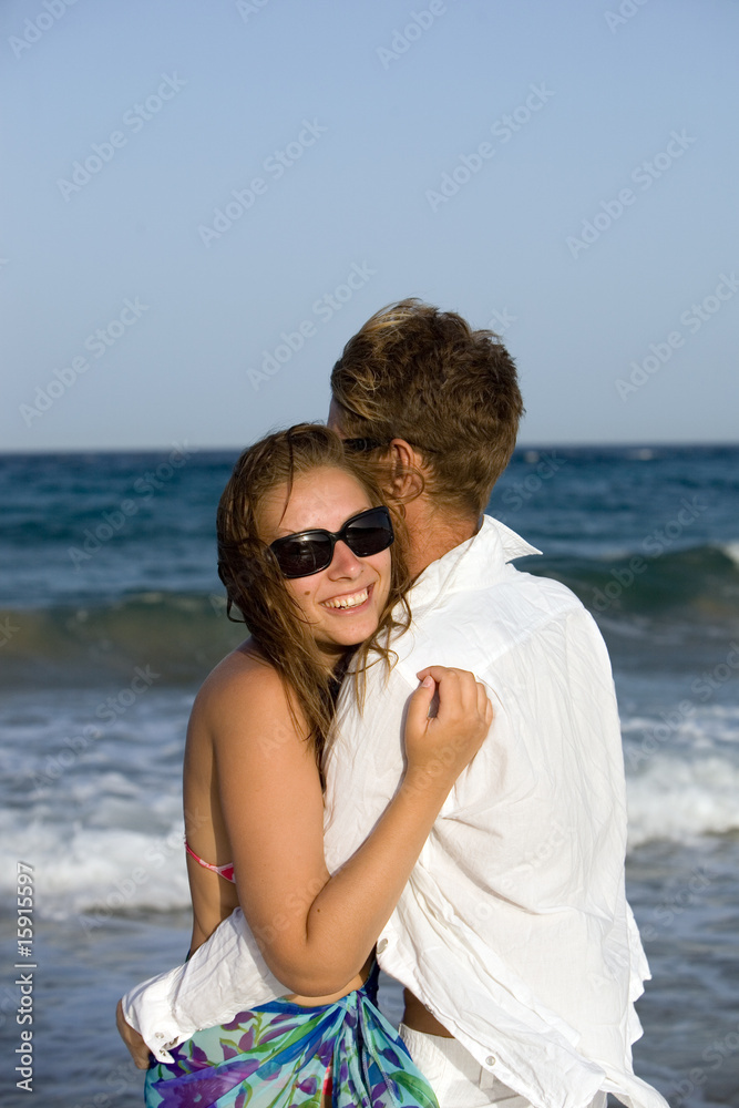 Beautiful young couple enjoying on beach Beautiful young couple enjoying on beach