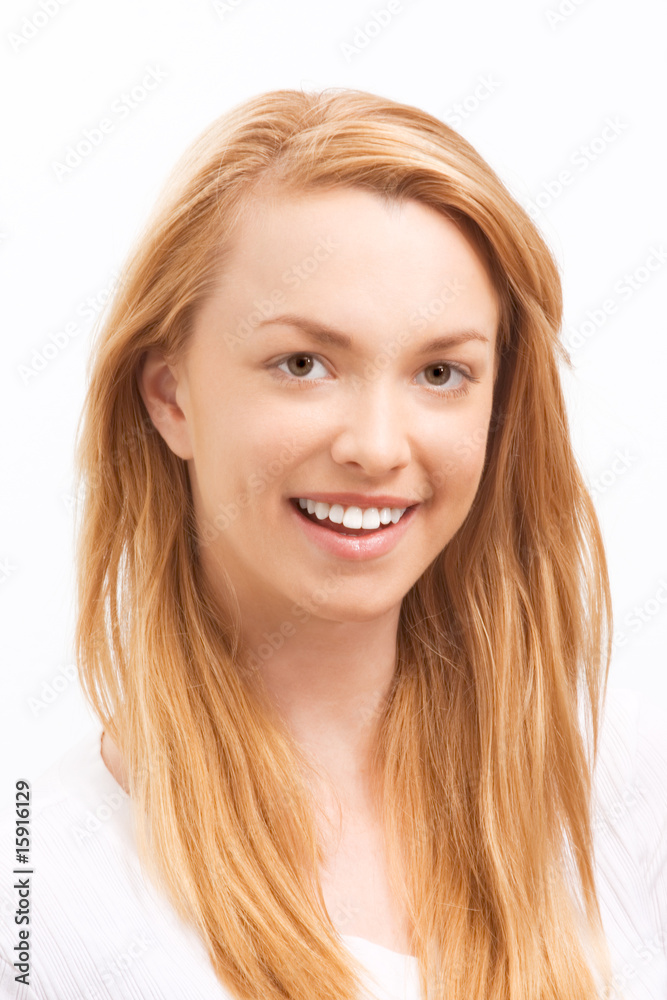 Smiling friendly young blond woman showing teeth Smiling friendly young blond woman showing teeth