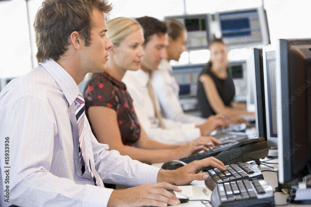 Stock Traders Working At Computers Stock Traders Working At Computers