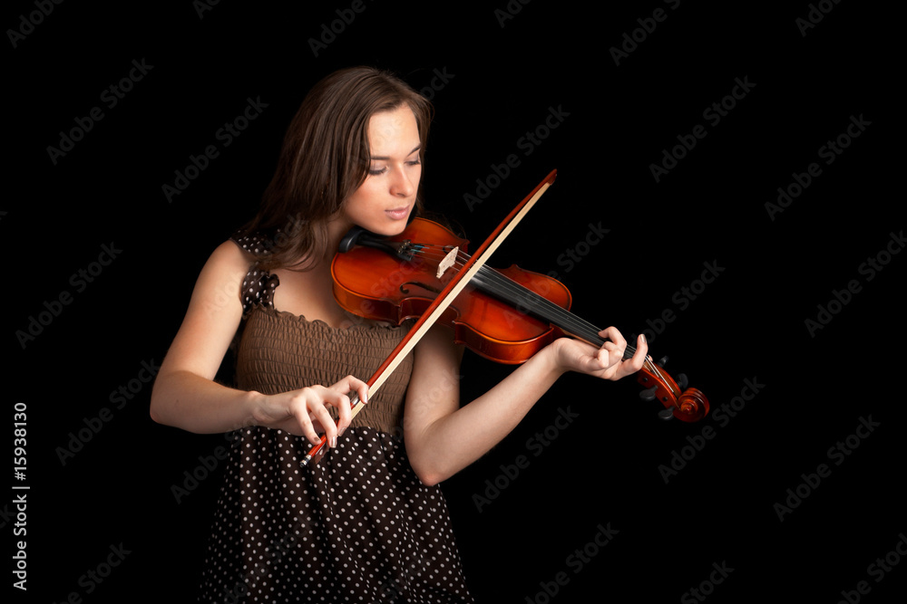 violinist isolated on black background