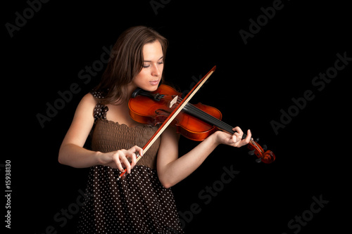 violinist isolated on black background