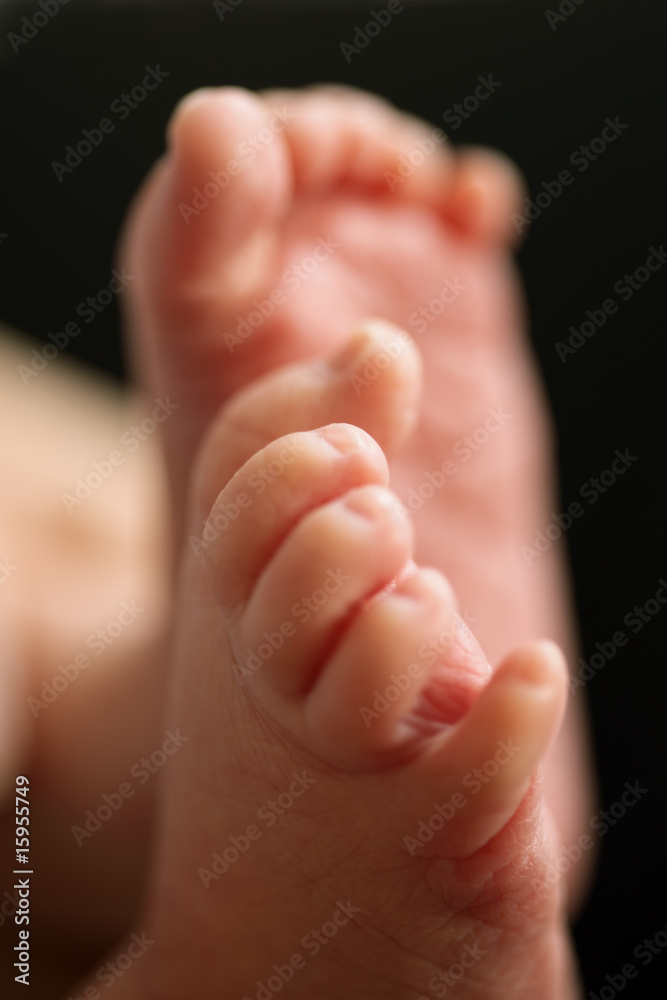 Tiny feet of a newborn baby