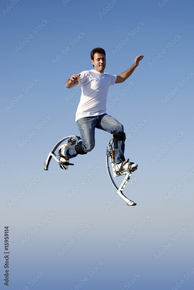 Obraz premium a young man jumping high in the sky