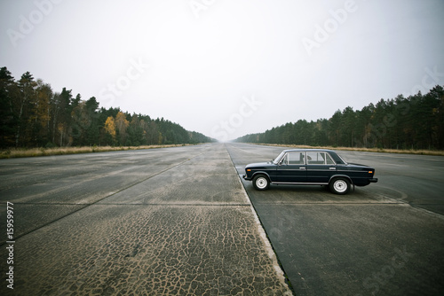 lonely old car on an airstrip © sint