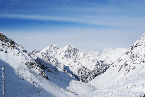 Clear blue sky in winter mountains above the peaks © Sergey Toronto