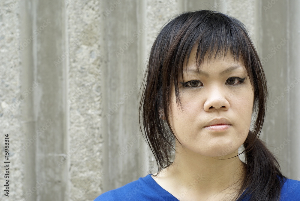 Serious looking teen lady in urban surroundings Serious looking teen lady in urban surroundings