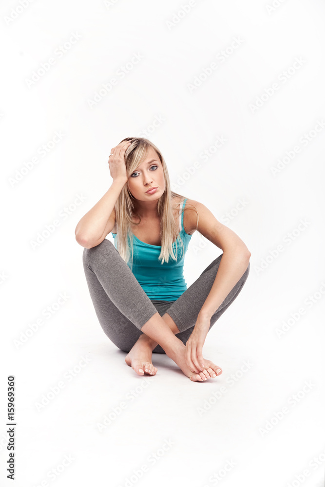 Worried young beautiful woman, white background Worried young beautiful woman, white background