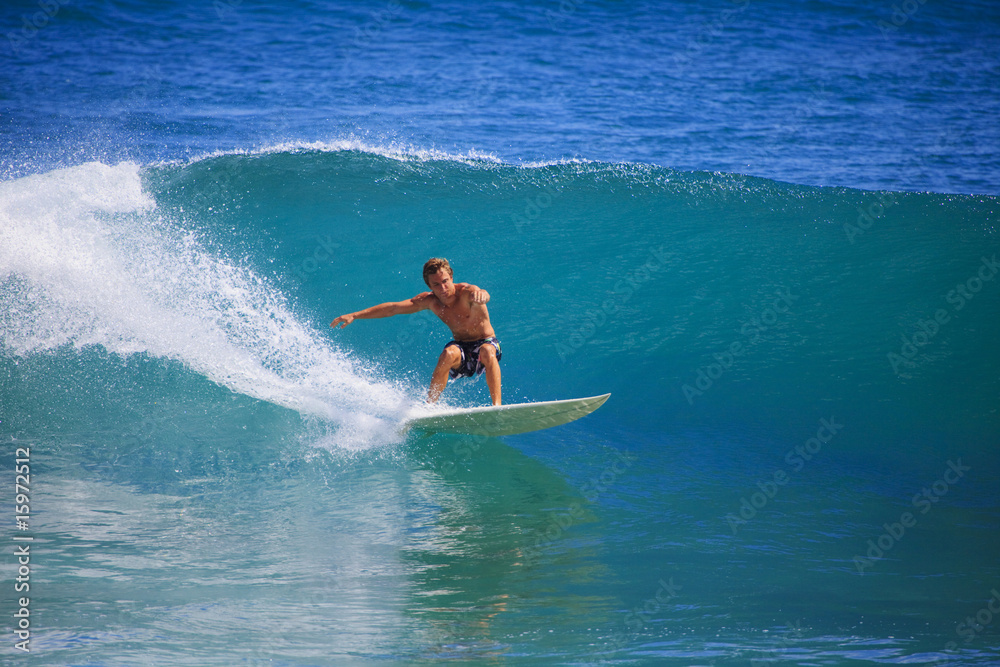 young man surfing at Point Panic, Hawaii young man surfing at Point Panic, Hawaii