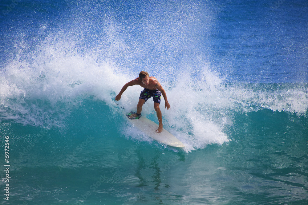 young man surfing at Point Panic, Hawaii