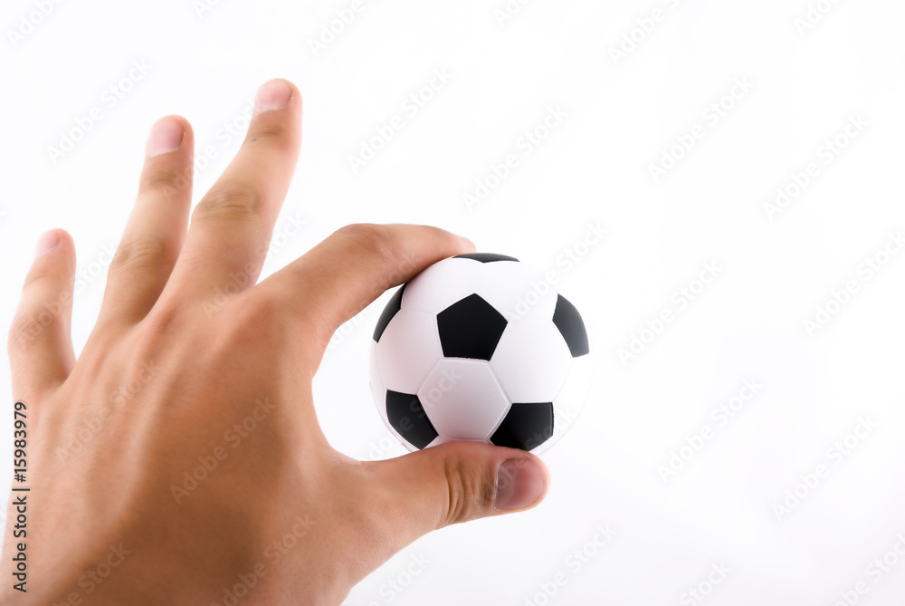 Hand holding football ball Hand holding football ball