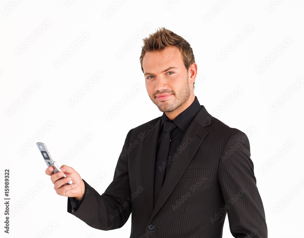 Businessman writing a message and looking at the camera Businessman writing a message and looking at the camera