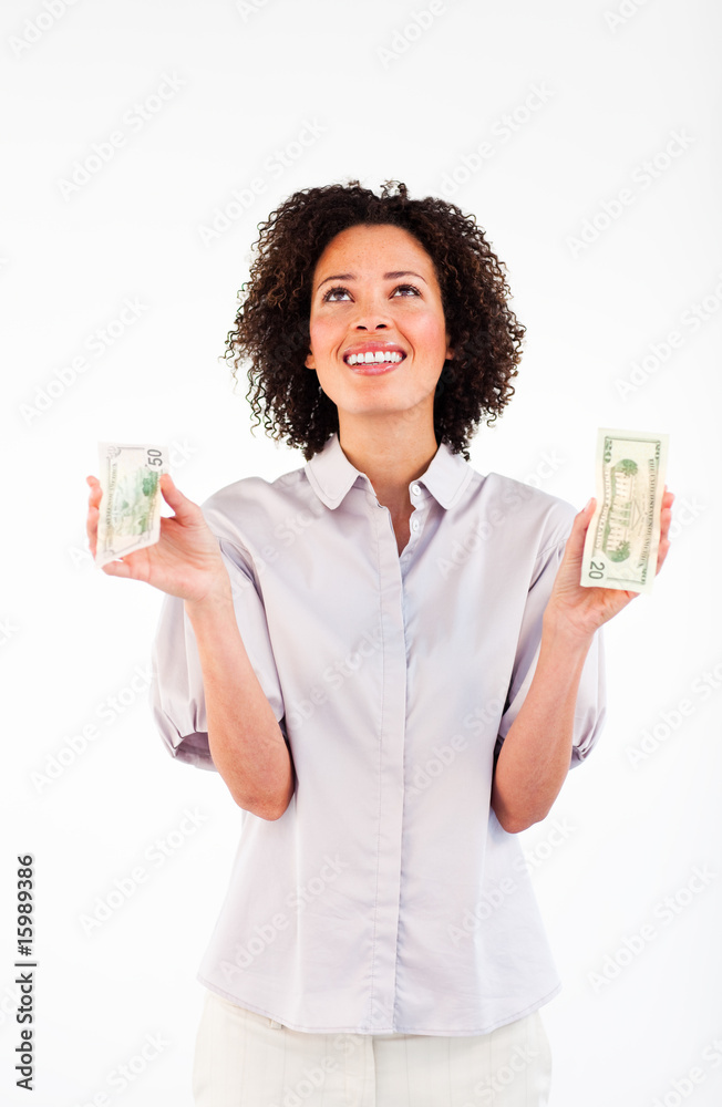 Smiling businesswoman holding dollars and looking upwards Smiling businesswoman holding dollars and looking upwards