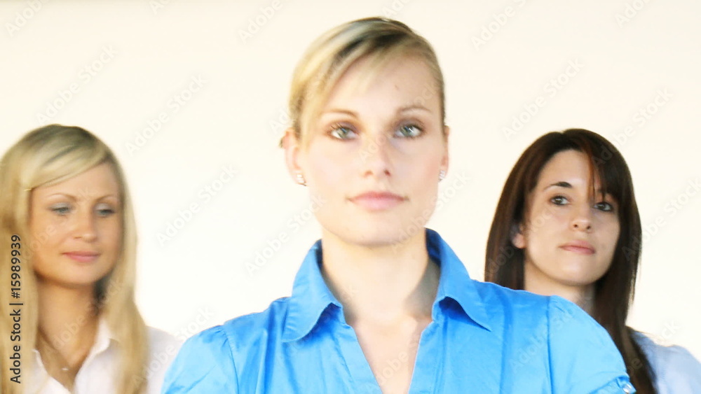 Three beautiful businesswomen smiling at the camera Three beautiful businesswomen smiling at the camera