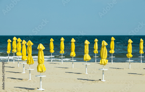 Deserted beach and beach umbrellas