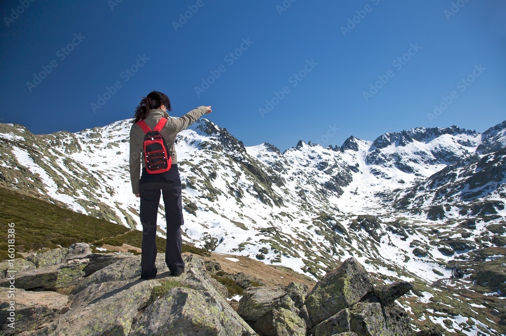 pointing a big snow mountain