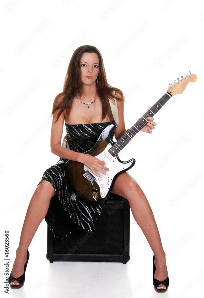 sexy brunette sitting on an amplifier with guitar sexy brunette sitting on an amplifier with guitar