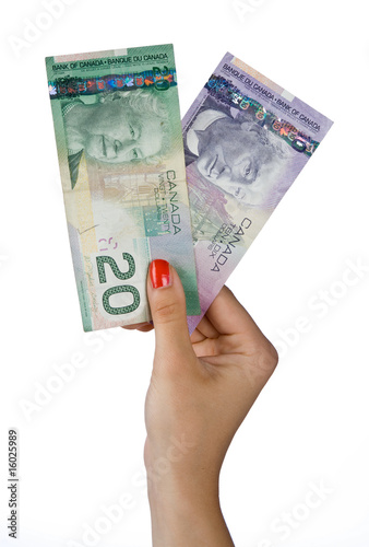 woman hand with canadian dollar bills