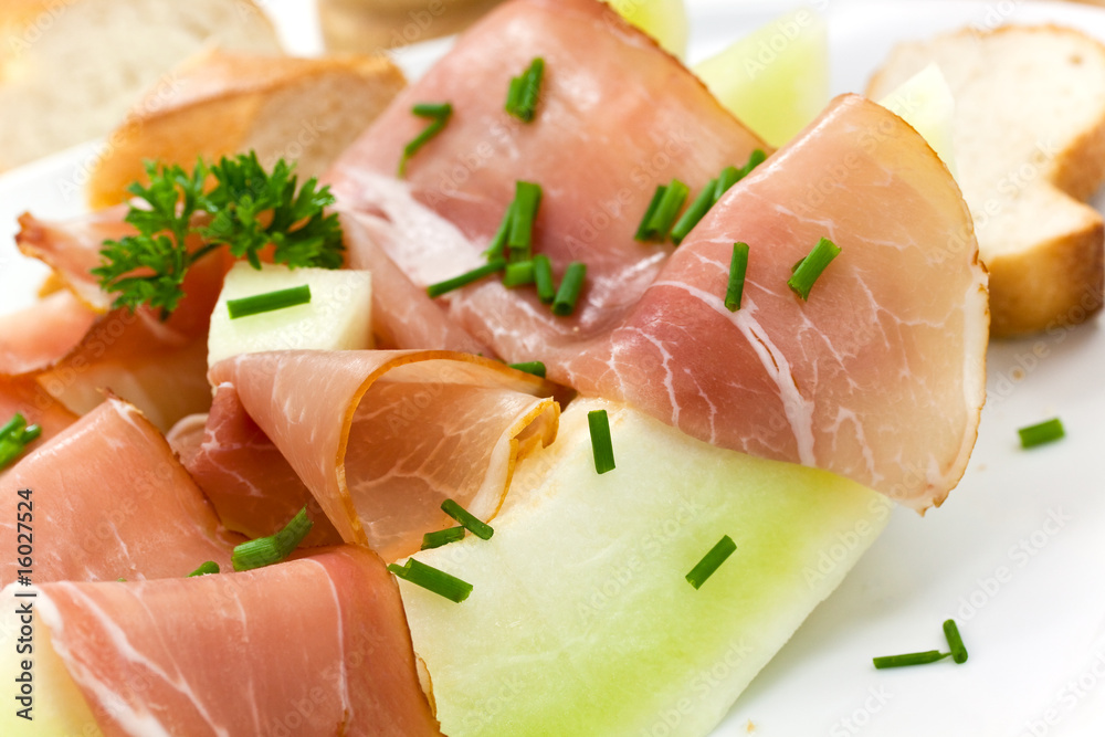 Prosciutto di Parma ham and three slice of melon Prosciutto di Parma ham and three slice of melon