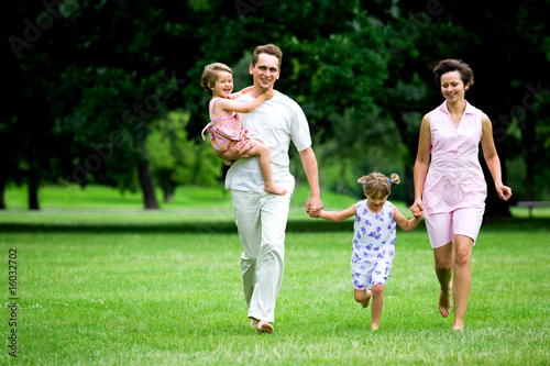 Family running in park