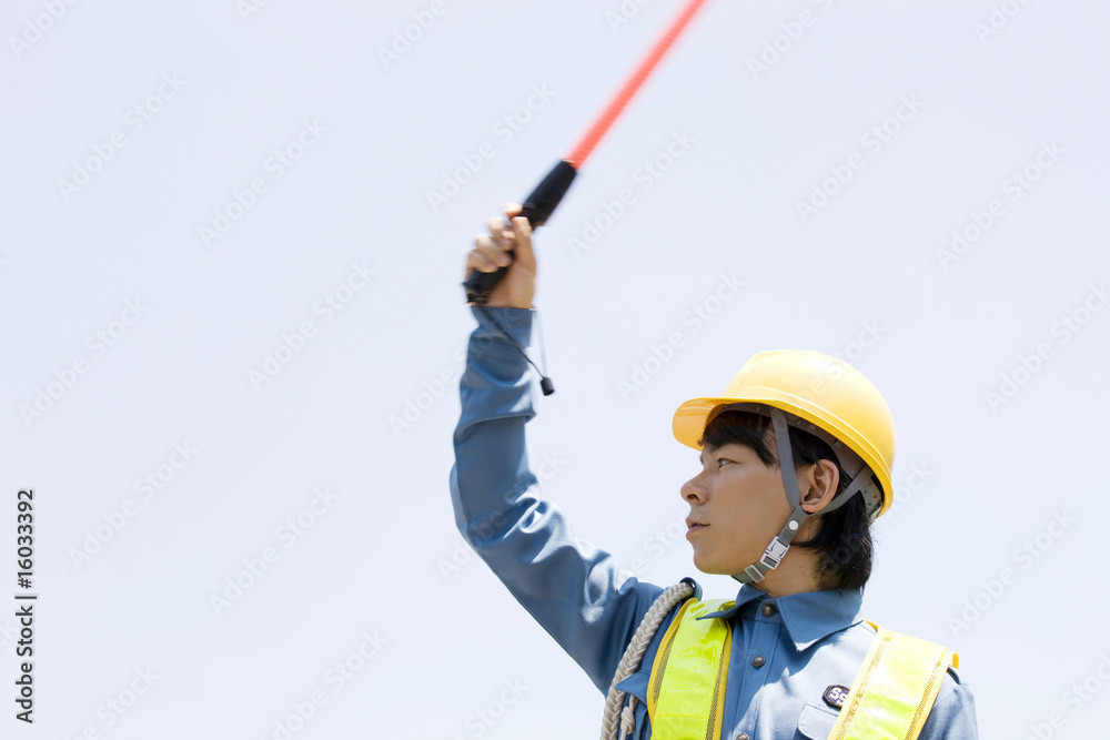 交通誘導を行う男性 Stock Photo Adobe Stock