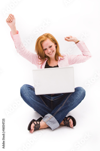 Beautiful freckled teen with computer