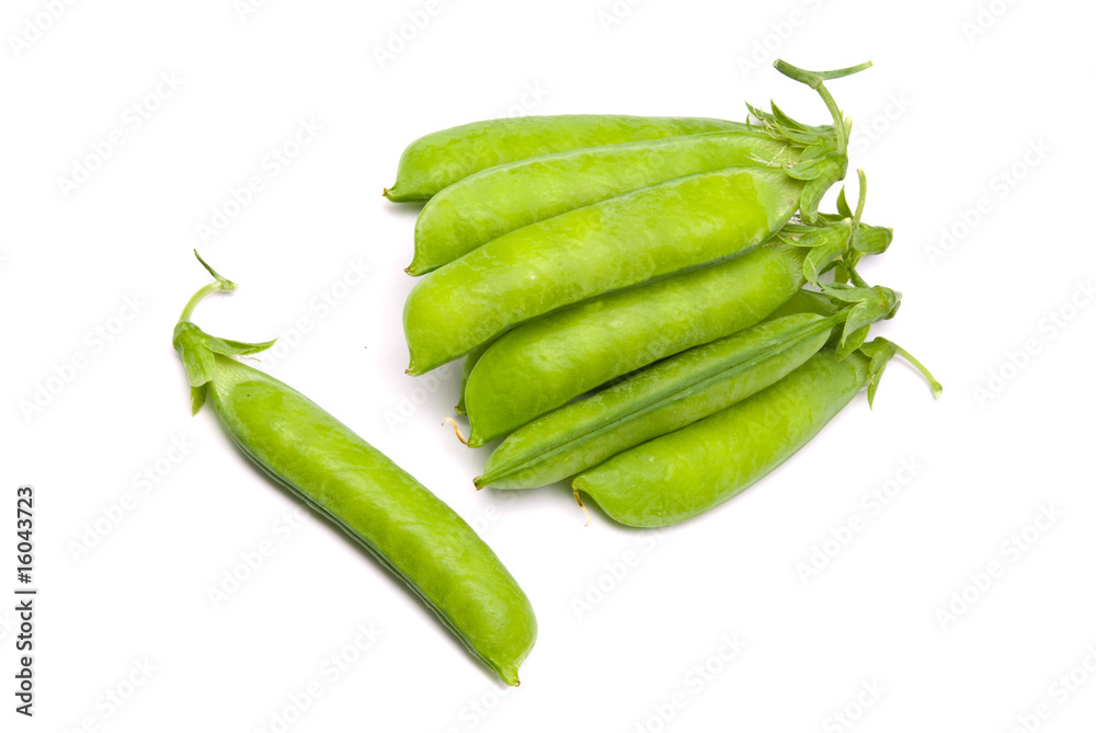 Pods of fresh green peas on a white background
