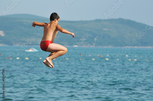 boy jump sea