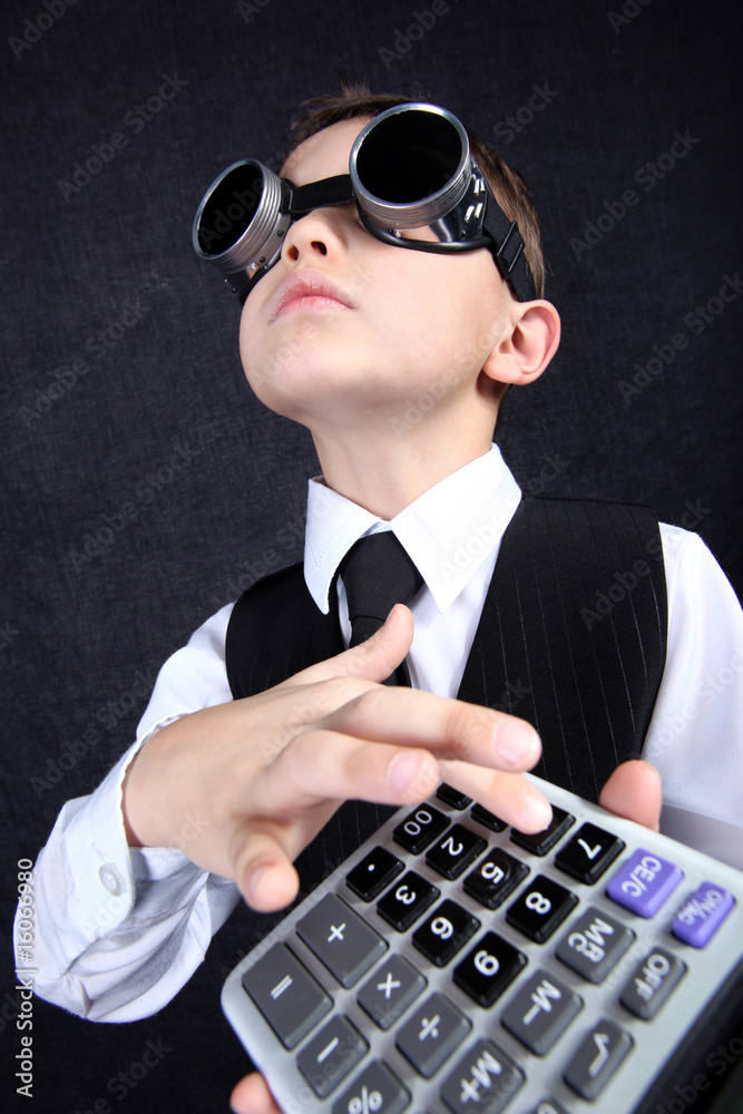 hard time in learning - boy with calculator hard time in learning - boy with calculator