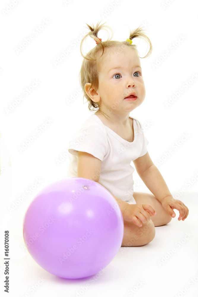 Adorable baby playing with ball