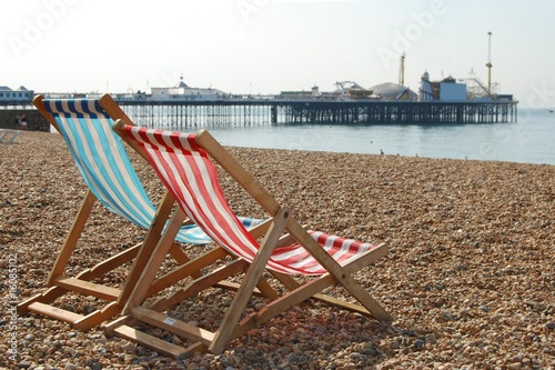 Deckchairs on Brighton beach and pier, England © Scott Latham