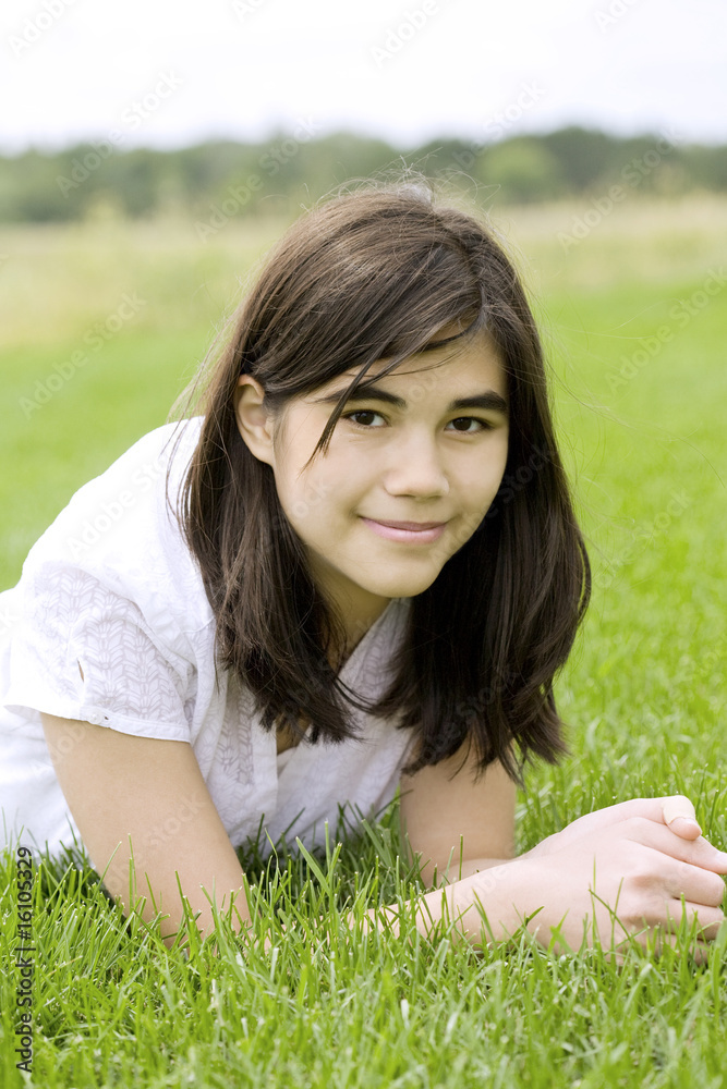 beautiful teen girl lying on grass beautiful teen girl lying on grass