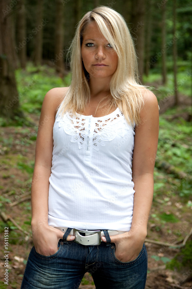young woman is posing in the forest young woman is posing in the forest