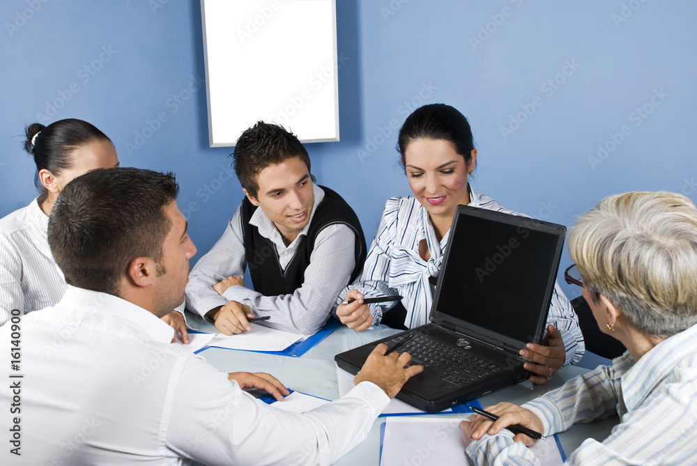 Business people working on laptop at meeting Business people working on laptop at meeting