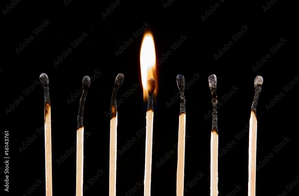 Burning match on a black Burning match on a black